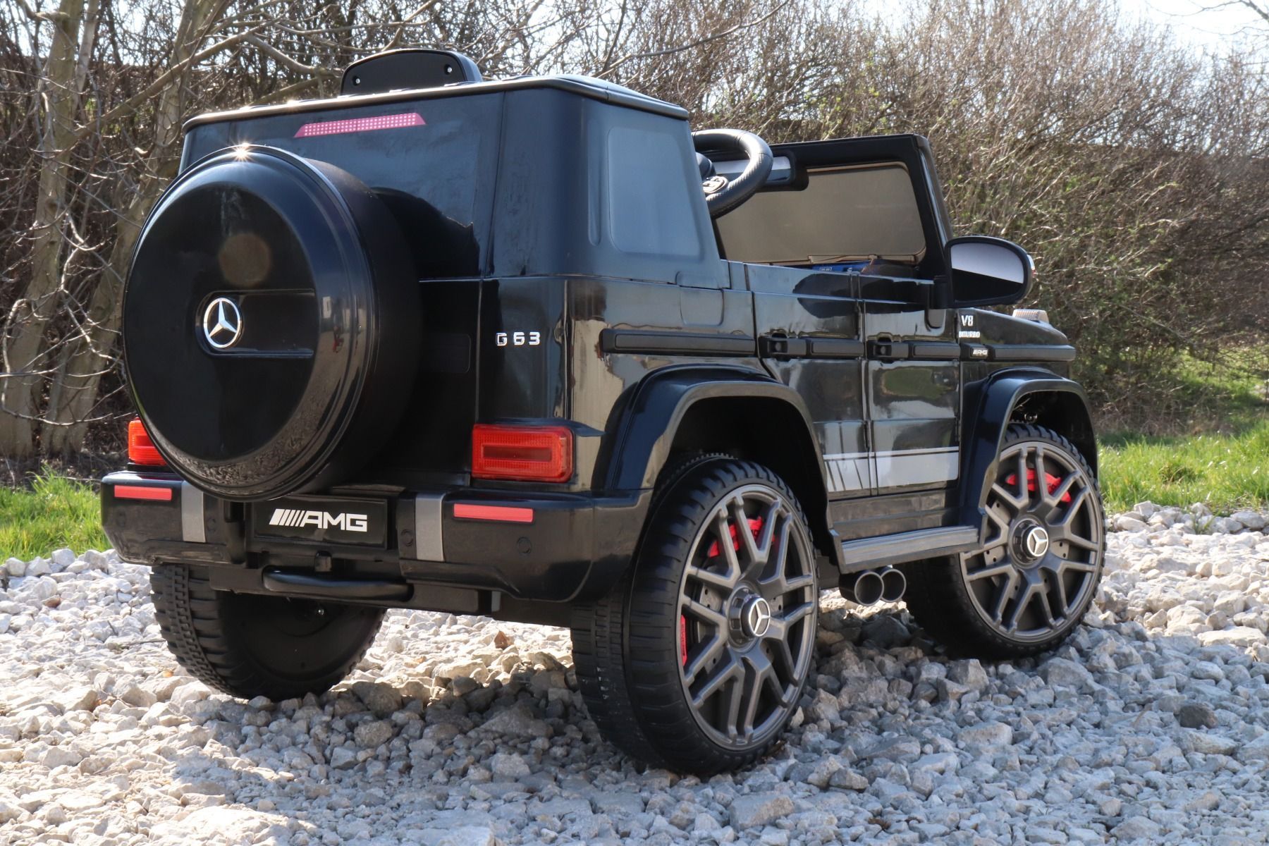 Elektroauto kinder Mercedes G Neu, Schwarz, Originallizenz, Batteriebetrieben, Türen öffnen, Einzelsitz, 2x Motor, 12 V Batterie, 2,4 GHz Fernbedienung, Hinterradfederung, Sanfter Start